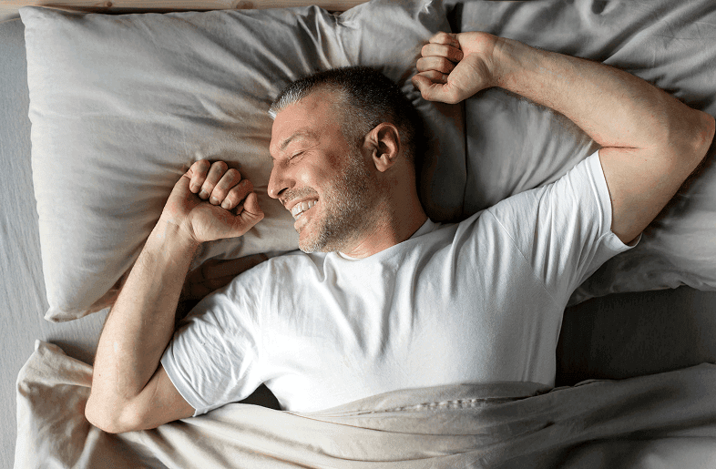 Man waking up refreshed